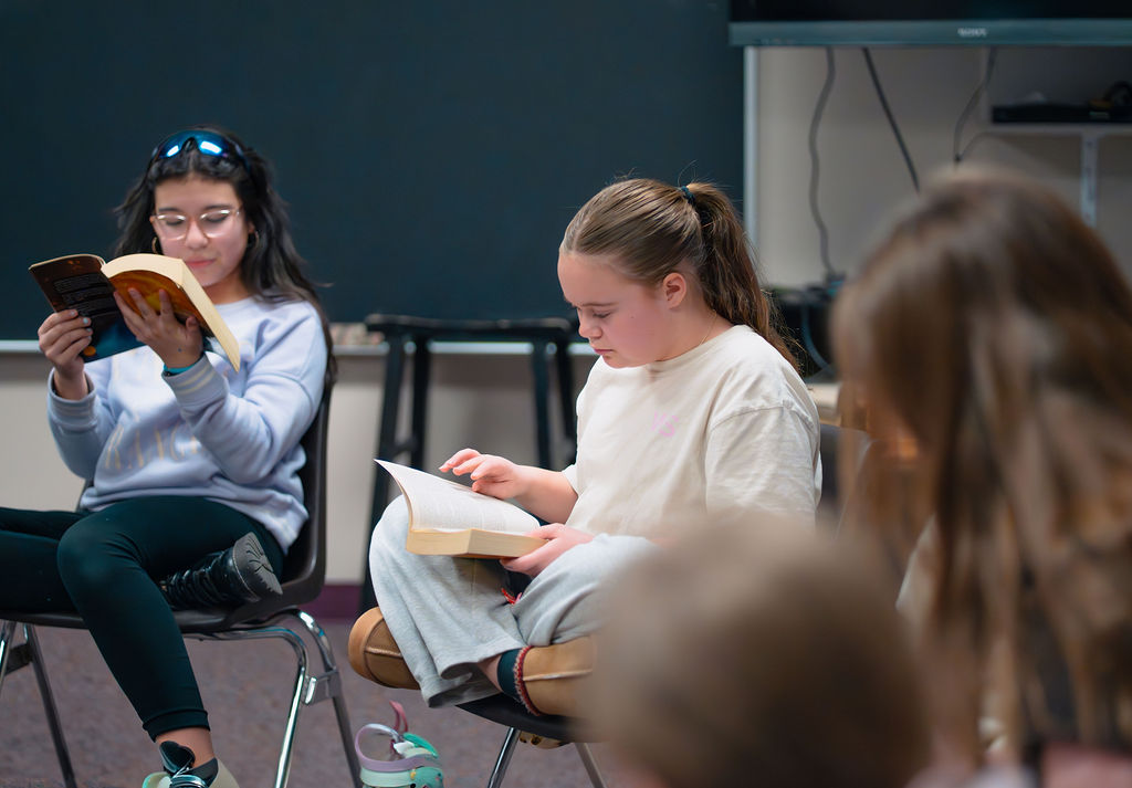 Students reading the Bible.